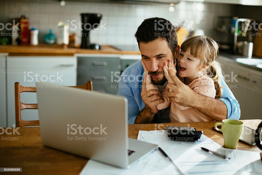 Photo of a father and daughter enjoying together